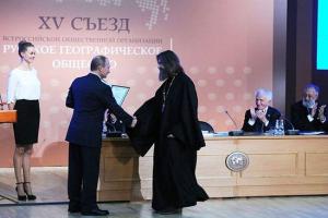 О.Федор Конюхов получает награду из рук В.Путина